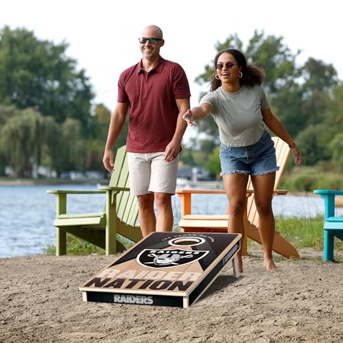 YouTheFan NFL 2' x 4' Slogan Series Professional Wood Cornhole Game with Logo Bags - color: Las Vegas Raiders