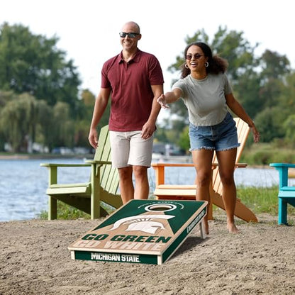 YouTheFan NCAA 2' x 4' Slogan Series Professional Wood Cornhole Game with Logo Bags - color: Michigan State Spartans