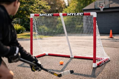 Mylec PVC Junior Hockey Folding Goal for Indoor + Outdoor (54 x 44 Inches), Lightweight & Portable, Sleeve Netting System (Red, 15 Pounds)